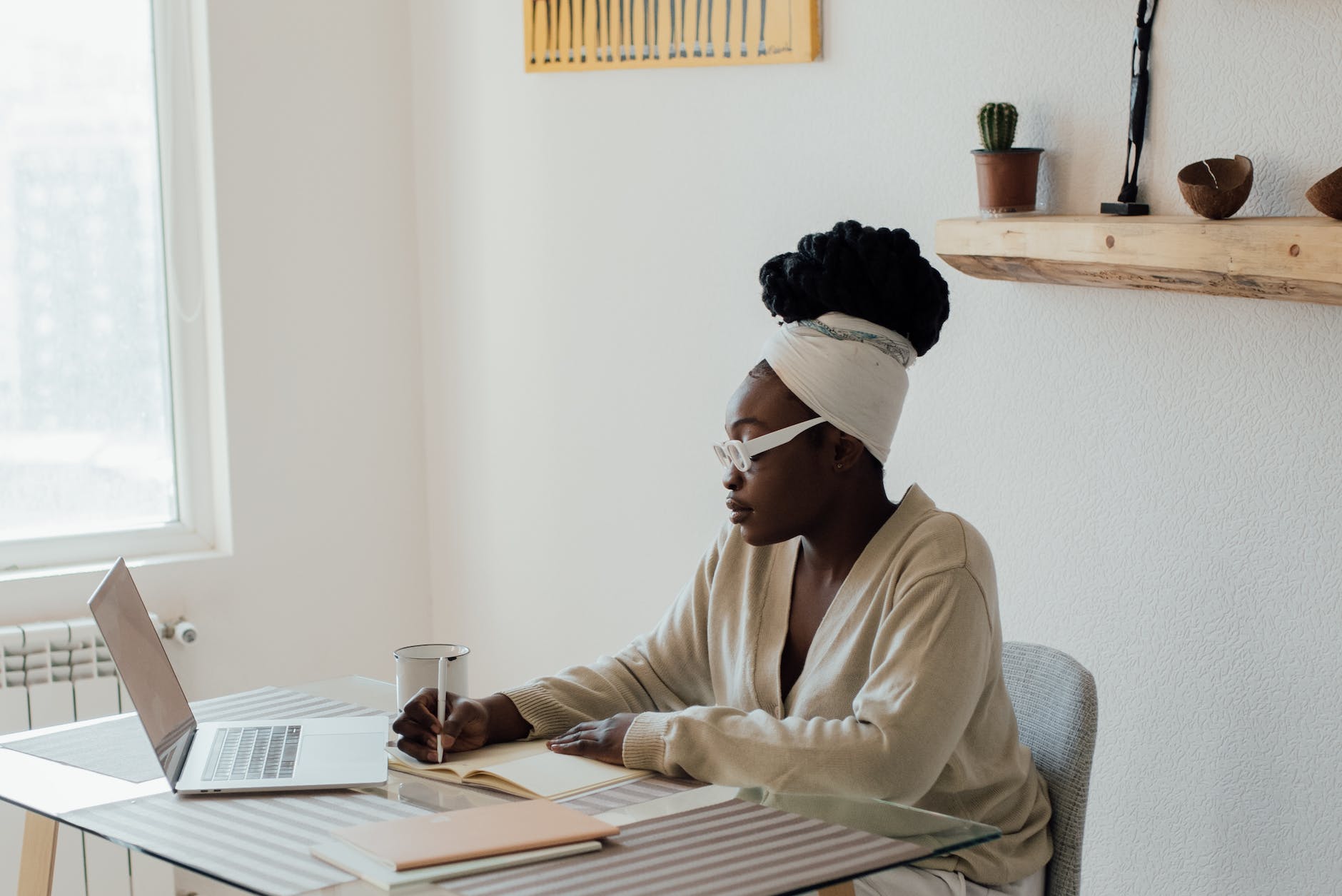 a woman working from home: Differences between informal and formal writing styles